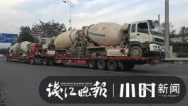 巨無霸來了！半掛車“背”著水泥車欲上高速！